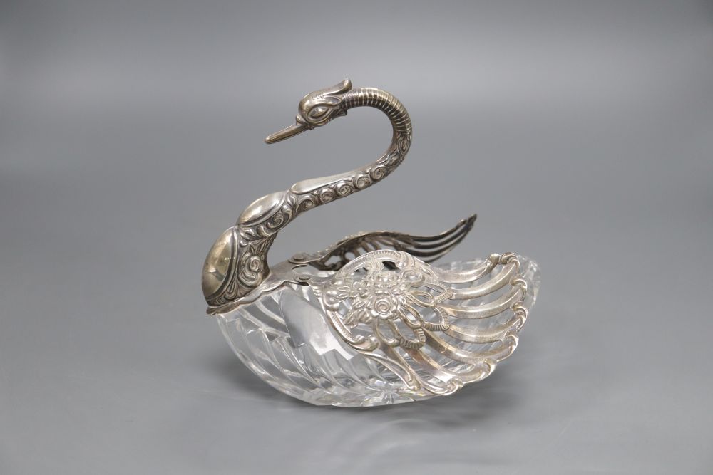 A cut glass pot pourri, in the form of a swan with embossed silver head and pierced hinged wings, London import marks for 1986